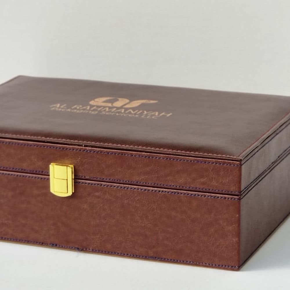 Leather presentation box with a gold clasp