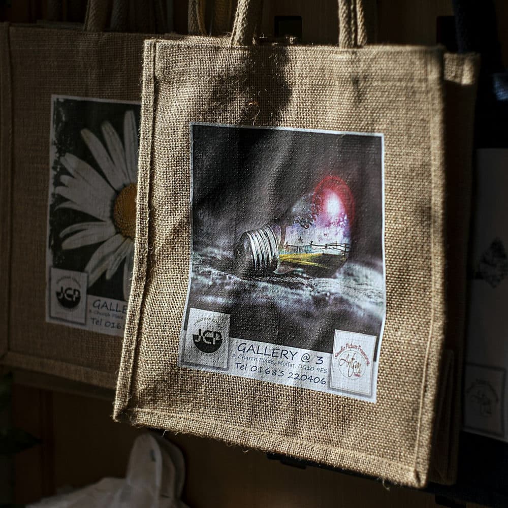 Printed jute bags hanging in sunlight