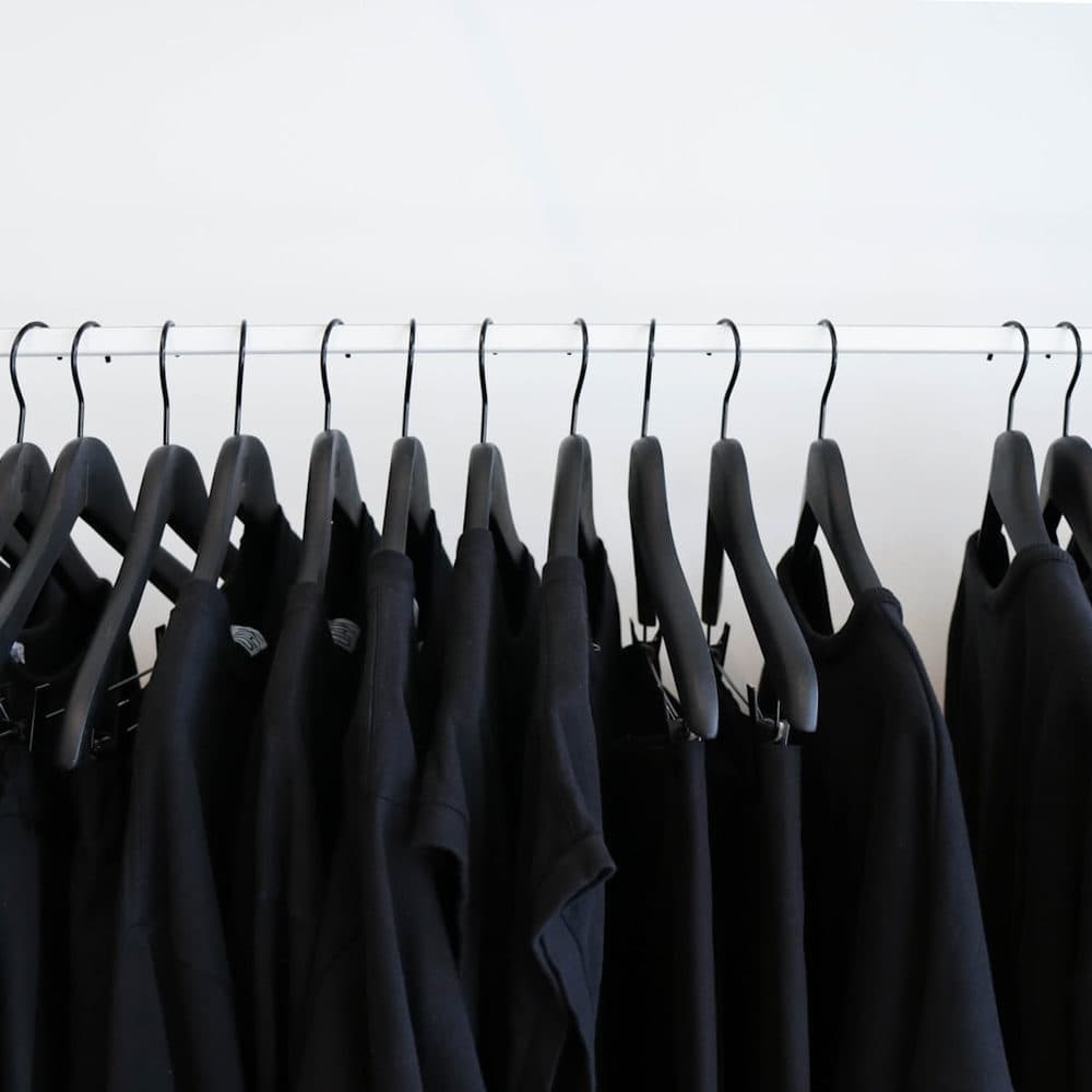 A rail of black garments